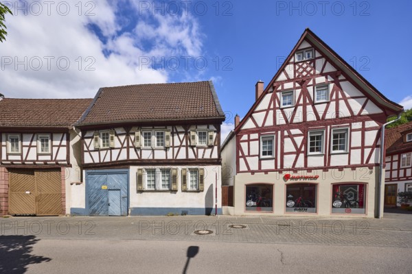 ROTWILD Store Heppenheim, bicycle shop, half-timbered houses, facade with windows, shutters and entrance gate, asphalt road, blue sky, cumulus clouds, federal road B460, Lehrstraße, Heppenheim, Odenwald, Bergstraße district, Hesse, Germany