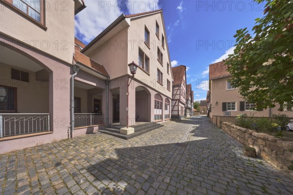 Building, old town, general architecture, half-timbered house, quarry stone wall, cobblestone pavement, tree, blue sky, cumulus clouds, small brook, Heppenheim, Odenwald, Bergstrasse district, Hesse, Germany