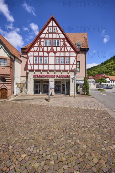 Starkenburg Passage, shopping centre, pedestrian zone, half-timbered houses, general architecture, pavement of cobblestones, blue sky, cumulus clouds, crossing Friedrichstraße with ditch, Heppenheim, Odenwald, Bergstraße district, Hesse, Germany