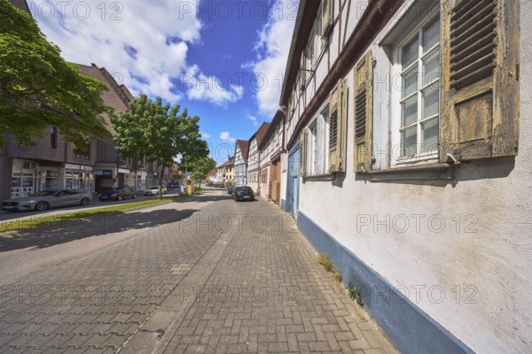 Historic half-timbered houses, general architecture, street, car park with vehicles, facade with windows and shutters, pavement, trees, blue sky, cumulus clouds, federal road B460, Lehrstraße, Heppenheim, Odenwald, Bergstraße district, Hesse, Germany