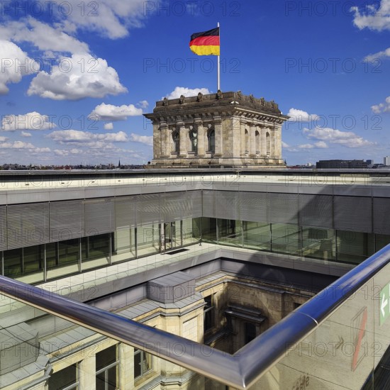 Viewing platform with a German flag in the wind on one of the corner towers and a view of an inner courtyard, government district, Berlin, Germany
