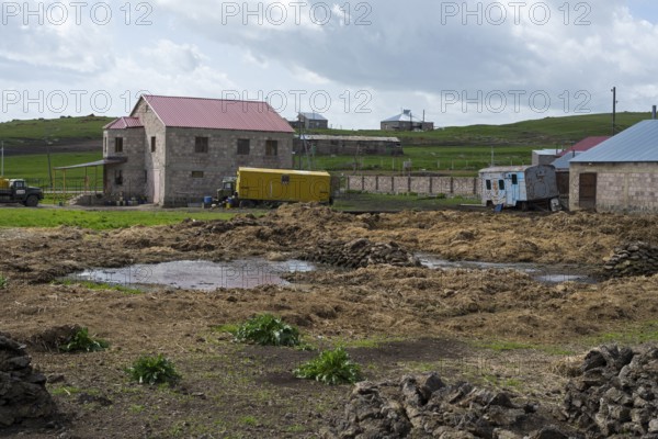 Rural scene with some buildings and caravans in a cloudy environment, Rya Taza, Ria Taza, Aragatsotn Province, Armenia