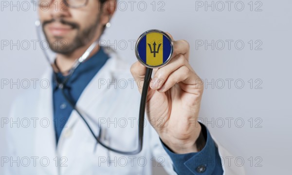 Doctor holding stethoscope with Barbados flag. Barbados health and care concept, Barbados flag on stethoscope