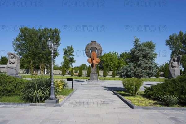 Park landscape with sculptures and plants under a blue sky, in the garden of the Yazidi Temple, Yazidi Temple, Aknalich, Aknalich, Armavir district, Armenia