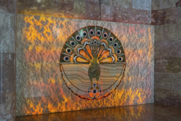 Detailed peacock pattern on a wall with orange lighting, showing symbolism and artistic decoration, Yazidi temple, Yazidi temple, the largest Yazidi temple in the world is called Quba Mere Diwane, Aknalich, Aknalich, Armavir district, Armenia