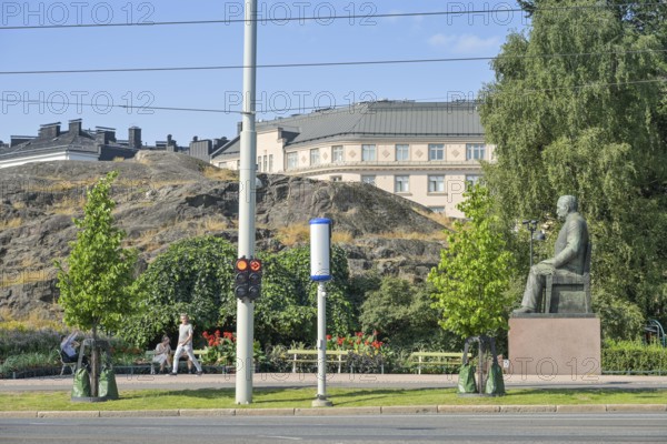 Street scene, passers-by, Kyösti Kallio statue, Mannerheimintie, Helsinki, Finland