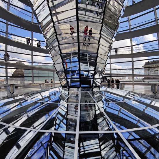 Interior view of the Reichstag dome with the mirror cone and visitors, Reichstag building, government district, Berlin, Germany