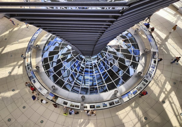 Reichstag dome, interior view from top to bottom of the mirror cone with visitors, Reichstag building, government district, Berlin, Germany