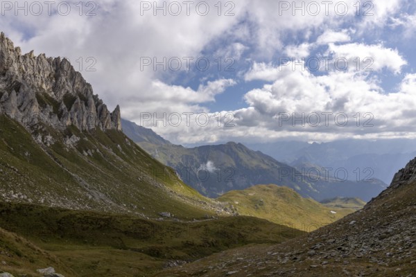 View from Passo del Sole towards Blenio Valley and Lukmanier, on the left steep rock faces at Campanítt, Pizz di Colómb, Olivone, Ticino, Switzerland
