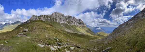 View from Passo del Sole towards Blenio Valley and Lukmanier, on the left steep rock faces at Campanítt, Pizz di Colómb, Olivone, Ticino, Switzerland