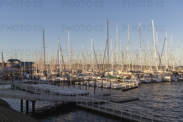 Olympic harbour Schilksee, Olympic Games 1972, sailing yachts at the jetty, ship masts, evening light, sunshine, blue sky, Baltic Sea, Kiel Bay, Kiel Sailing City, Schleswig-Holstein, Germany