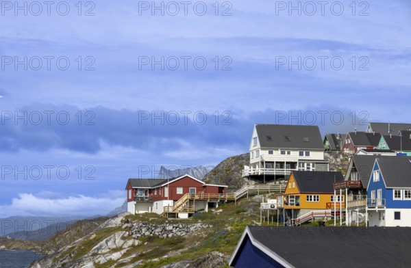 Panoramic view of Greenland capital Nuuk with colored houses located near fjords and icebergs