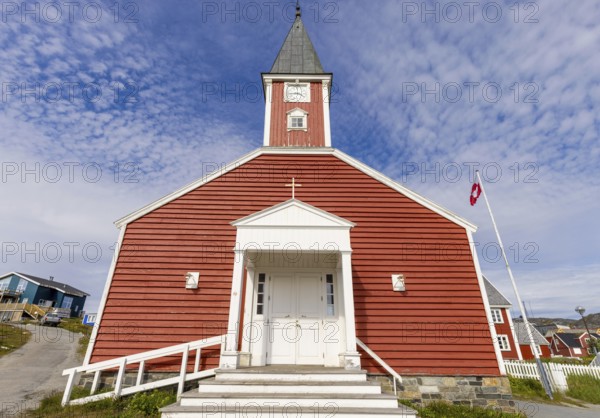 Panoramic view of Greenland capital Nuuk with church and colored houses located near fjords and icebergs