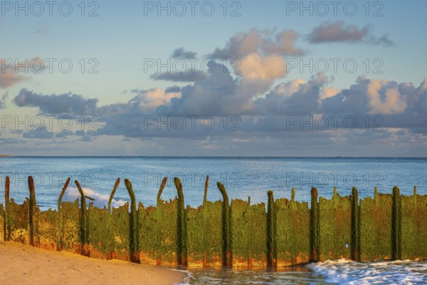 Sunrise on Ellenbogen beach, breakwater, coastal protection, North Sea island of Sylt