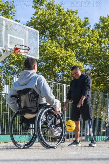 Men with a wheelchair and a prosthetic leg are happily dribbling a yellow basketball on an outdoor court, symbolizing sports inclusivity, friendship, and overcoming challenges