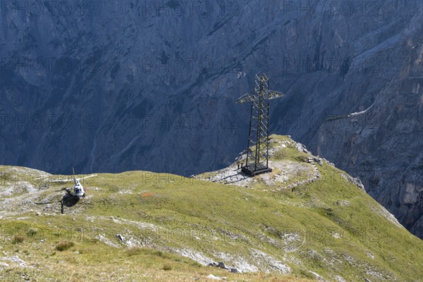 Dismantling of the old 220 kV power line at the Torscharte at the transition towards the Hagengebirge. It will be replaced by the new 380 kV Salzburg line. The electricity pylons and cables are removed in individual parts by helicopter. Salzburger Land, Austria