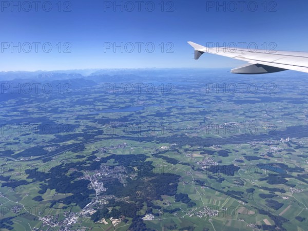 View from the aeroplane of Bürmoos and Lamprechtshausen, Salzburger Land, as well as Lake Waginger See and Lake Chiemsee with the Alps, Bavarian Alpine foothills, Chiemgau, Bavaria, Germany and Austria