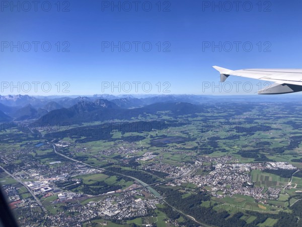 View from the aeroplane of Freilassing and the north of Salzburg with the Chiemgau Alps and the foothills of the Alps with the Saalach, Bavaria and Salzburger Land, Germany and Austria