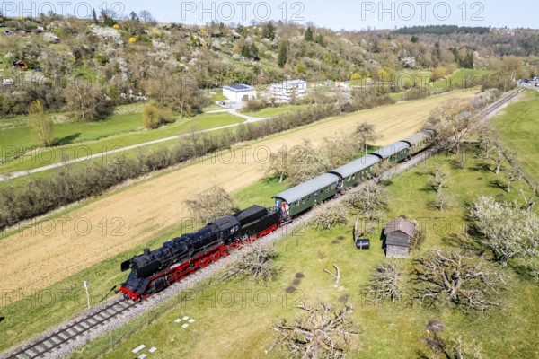 Steam train Feuriger Elias Aerial view from above on the Strohgäubahn steam railway railway steam locomotive in Weissach, Germany