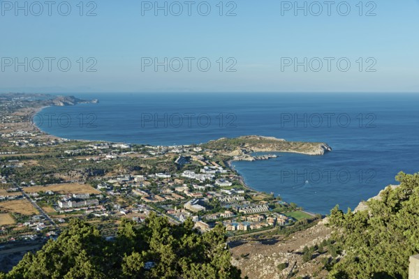 Coastal landscape of Kolymbia and Faliraki, with a view of the sea and town in the foreground under a clear sky, Church of the Virgin Mary Tsambika (Kyra Psili), Archangelos, Rhodes Island, Greece