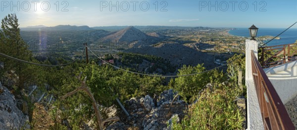 Panoramic view over the Mediterranean landscape of Kolymbia and Faliraki with mountains, coast and lush greenery in sunlight, Church of the Virgin Mary Tsambika (Kyra Psili), Archangelos, Rhodes Island, Greece