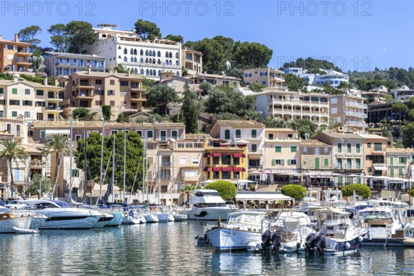 Port de Soller town on Majorca holiday by the sea yacht harbour with boats trip in Port de Sóller, Spain