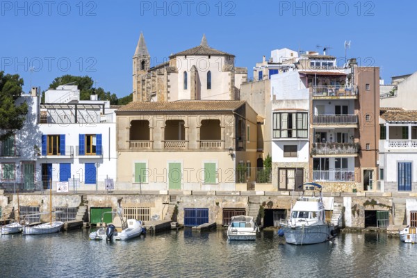 Colourful houses in Portocolom Fishing village on Majorca with boats Seaside holiday in Portocolom, Spain
