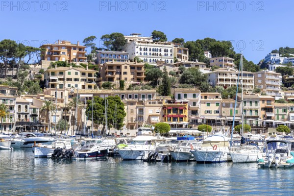 Port de Soller town on Majorca holiday by the sea yacht harbour with boats trip in Port de Sóller, Spain