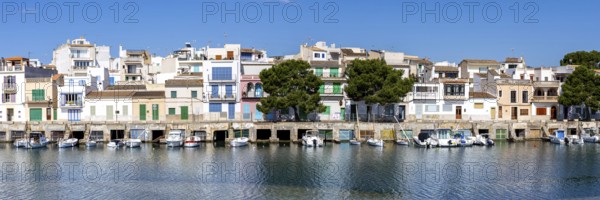Colourful houses in Portocolom Fishing village on Majorca with boats Holiday by the sea Panorama trip in Portocolom, Spain
