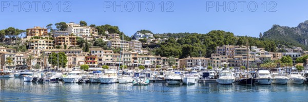 Port de Soller town on Majorca holiday by the sea yacht harbour with boats panoramic trip in Port de Sóller, Spain