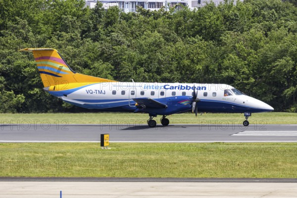 An Embraer EMB-120 Brasilia aircraft of InterCaribbean Airways with the registration number VQ-TMJ at San Juan Airport, Puerto Rico