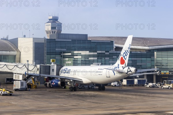 A JetBlue Airways Airbus A320 aircraft with the registration number N586JB and the I love NY special livery at San Juan Airport, Puerto Rico