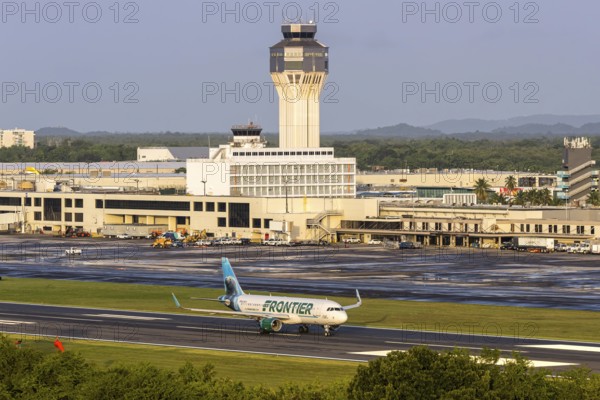A Frontier Airlines Airbus A320 aircraft with the registration number N238FR at San Juan Airport, Puerto Rico