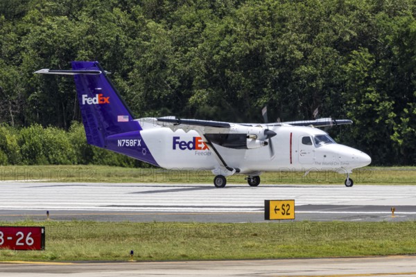 A FedEx Feeder Cessna 408 Skycourier aircraft with registration N758FX at San Juan Airport, Puerto Rico