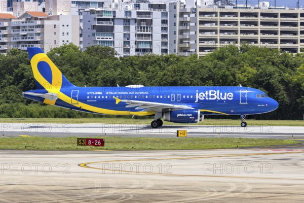 A JetBlue Airways Airbus A320 aircraft with the registration N775JB and the JetBlue Honours our Veterans special livery at San Juan Airport, Puerto Rico