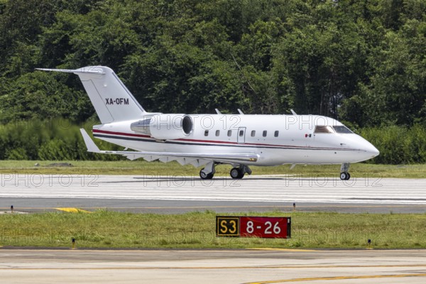 A Bombardier Challenger 604 private jet aircraft with the registration XA-OFM at San Juan Airport, Puerto Rico