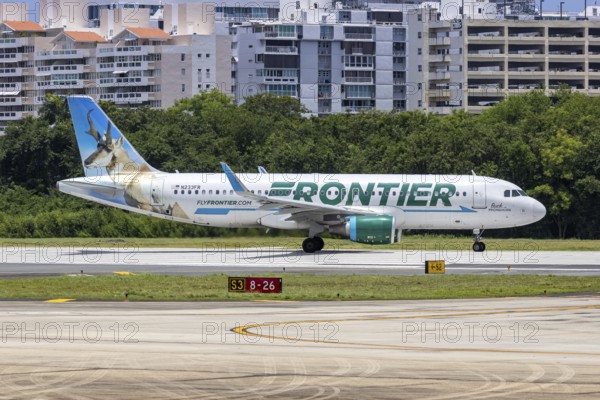 A Frontier Airlines Airbus A320 aircraft with the registration number N233FR at San Juan Airport, Puerto Rico