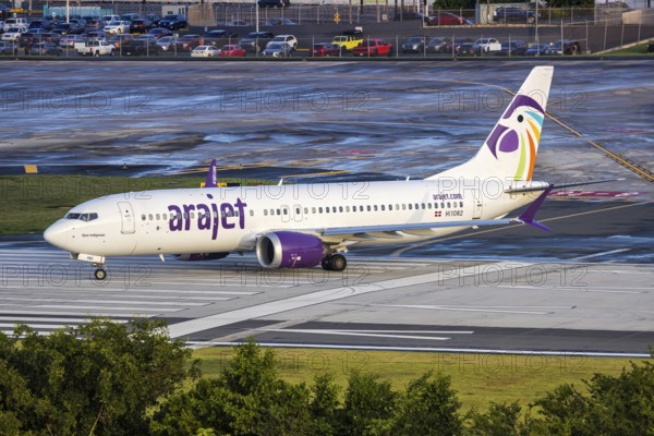 An Arajet Boeing 737 MAX 8 aircraft with registration number HI1082 at San Juan Airport, Puerto Rico