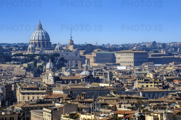 View over the historic centre of Rome with Vatican City in the background and St. Peter's Basilica on the left. Antenna of Vatican Radio to the right, Palazzo Apostolico Apostolic Palace to the right, Rome, Lazio, Italy