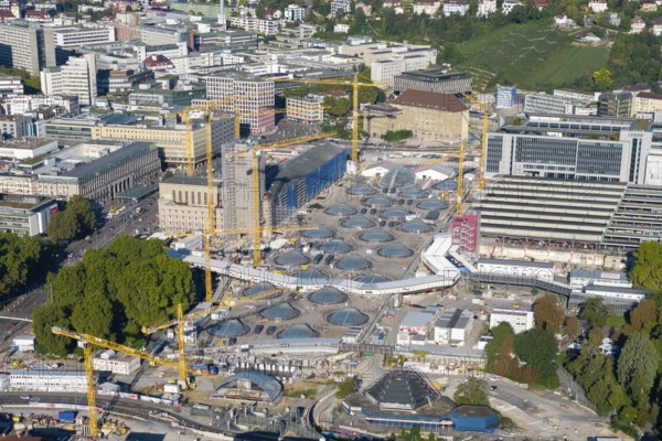 Panoramic view of modern construction site with glass structures and cranes in an urban green area, large construction site, Stuttgart railway station, Stuttgart 21, Baden-Württemberg, Germany