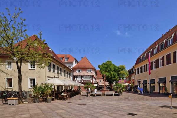 Ettlingen, Germany - August 13th 2025: Fountain at Ettlingen Schlosplatz town square on a sunny day in Germany
