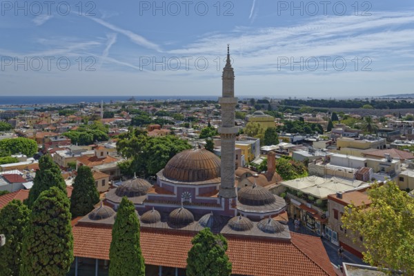 A panoramic view with minaret and domes in front of a cityscape of Rhodes and the sea in the background, Suleiman Mosque, Medieval Town of Rhodes, Rhodes Island, Greece