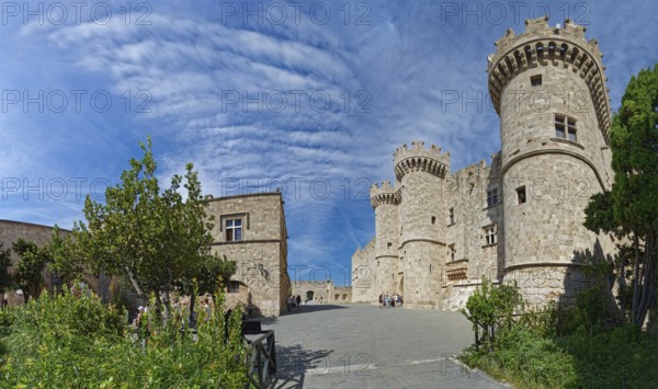 Wide view of a medieval castle with towers and stone walls under a cloudy sky, Grand Master's Palace, Medieval Town of Rhodes, Rhodes Island, Greece