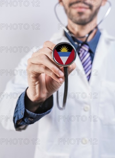 Antigua and Barbuda health and medical insurance concept. Antigua and Barbuda healthcare system, doctor holding stethoscope