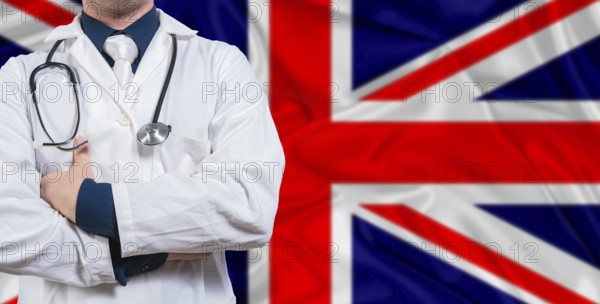 Male doctor with stethoscope on United Kingdom flag. Doctor holding stethoscope on United Kingdom flag