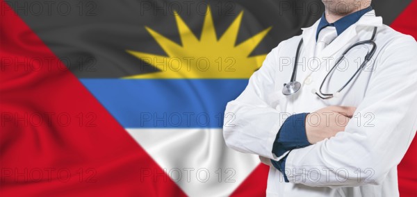 Antigua and Barbuda healthcare concept. Male doctor on Antigua and Barbuda flag. Doctor with crossed arms on Antigua and Barbuda flag