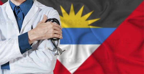 Doctor with stethoscope on Antigua and Barbuda flag. Doctor holding stethoscope on Antiguan and Barbudan flag