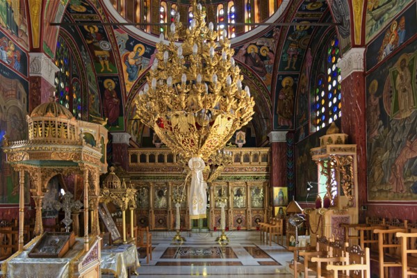Richly decorated interior of an Orthodox church with icons and stained glass windows, Greek Orthodox Church of Saint Pantaleon, Siana, Rhodes Island, Greece