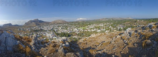 Panoramic view of the town of Archangelos in the middle of a vast and sunny mountain landscape, Archangelos, Rhodes Island, Greece