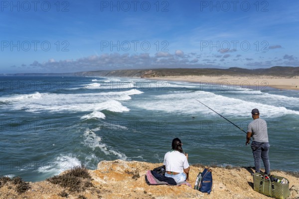 Anglers on the cliffs at the viewpoint above Praia da Bordeira beach, near Carrapateira, popular with surfers, surfers, rocky coast, cliffs in the south-west of the Algarve, Portugal